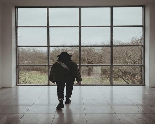 Person standing near window