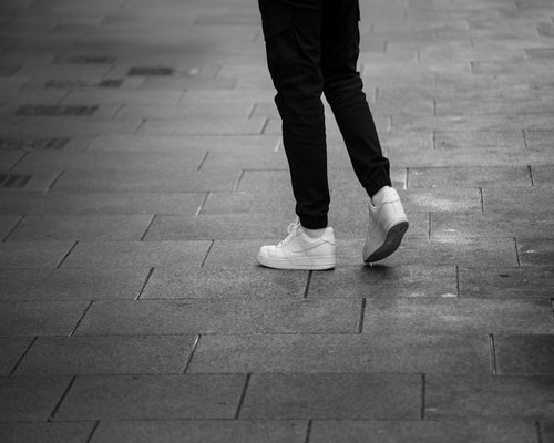 Comfortable walking shoes on city pavement